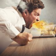 Businessman spits fire and melts the computer